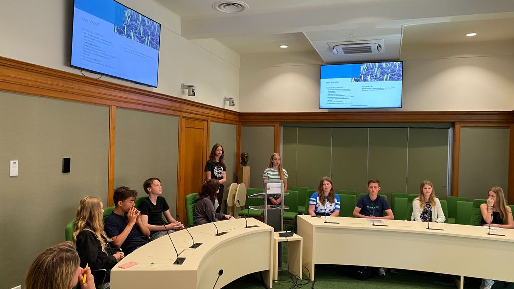 Foto: “Stap op de fiets, dan verspil je niets”